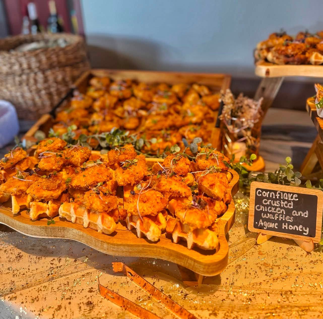 Cornflake crusted chicken and waffles on an event display